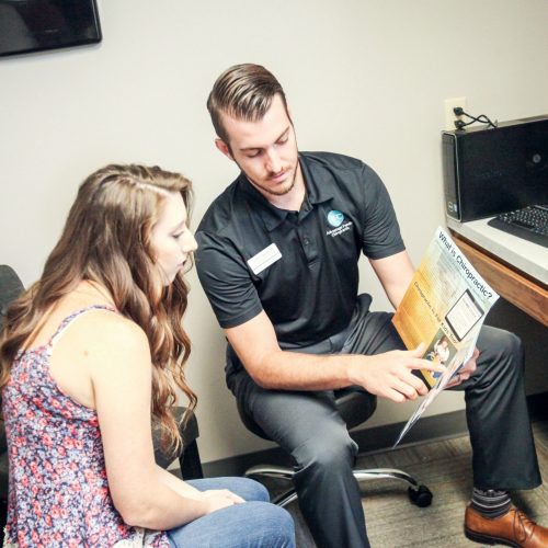 Advantage Family Chiropractic Chiropractor briefing a patient